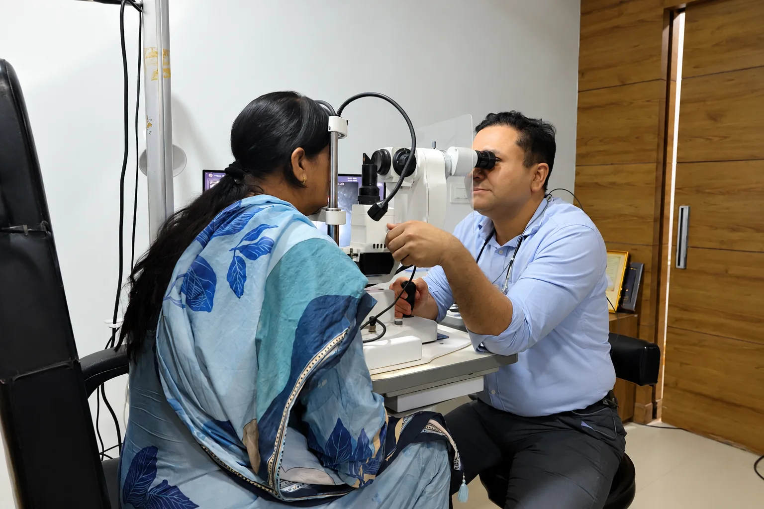 Doctor assessing a patient’s eye with an examination instrument