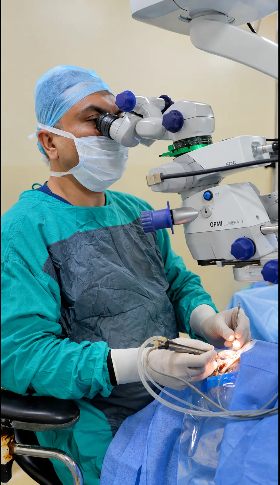 Ophthalmic surgeon working at an operating microscope