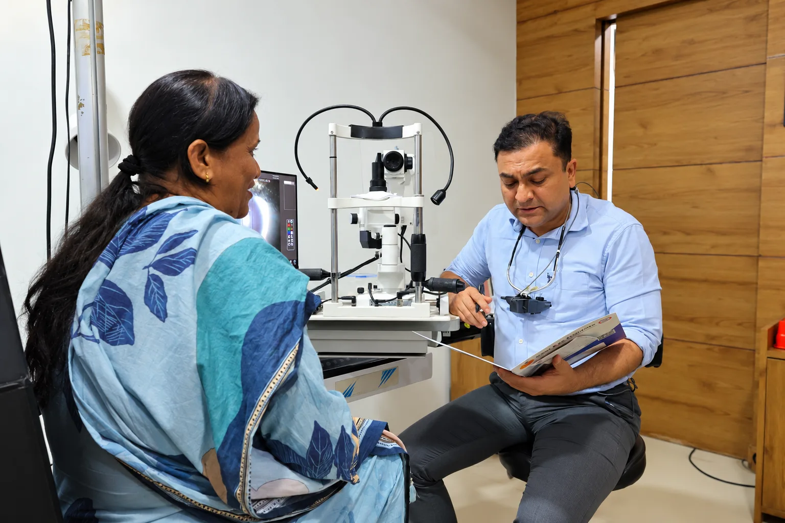Patient having an eye assessment with an ophthalmologist
